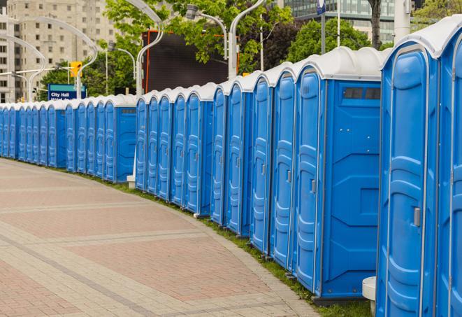 hygienic portable restrooms lined up at a music festival, providing comfort and convenience for attendees in Beaumont CA